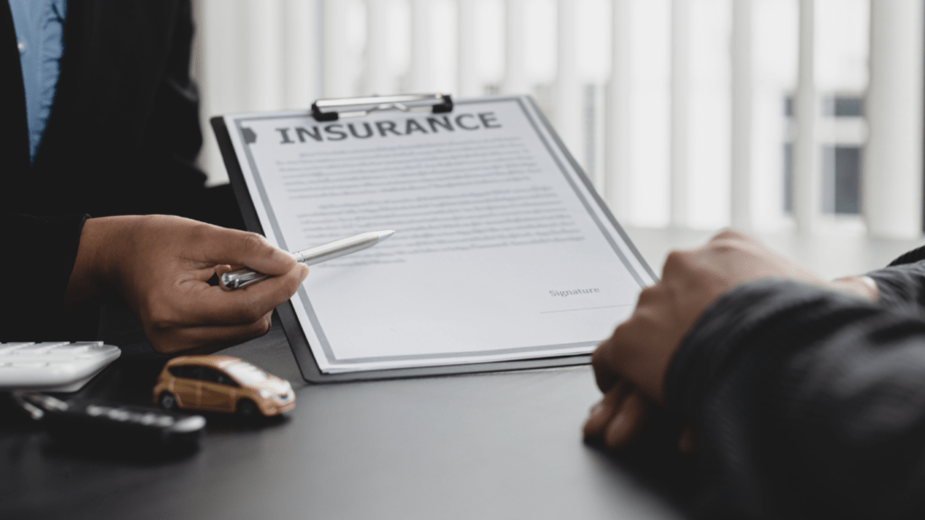 a person signing a mortgage document 