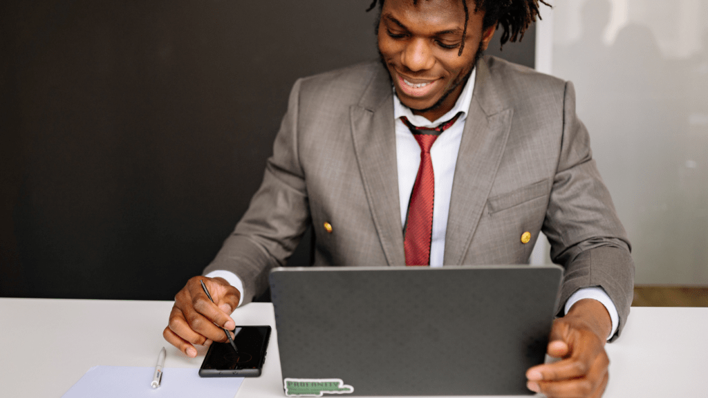 a person sitting in front of a computer 