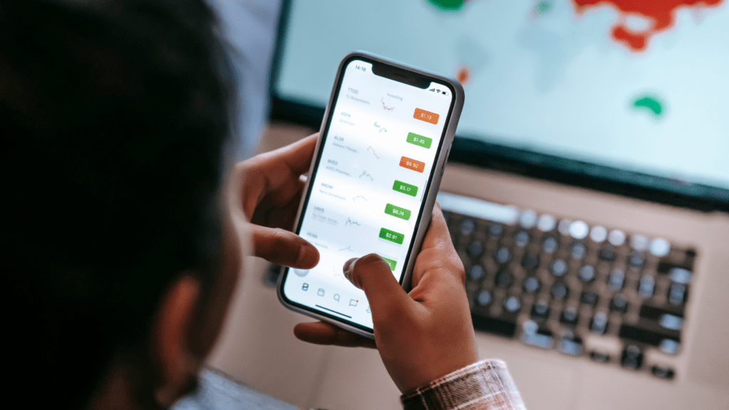 a person using a smartphone to check the stock market